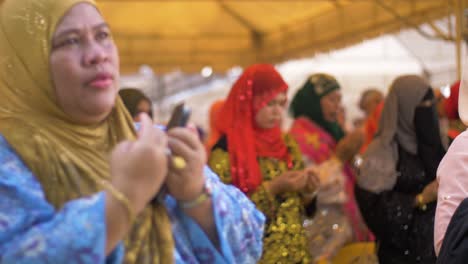 Women-pray-at-an-event-celebrating-National-Women's-Month-in-the-Philippines