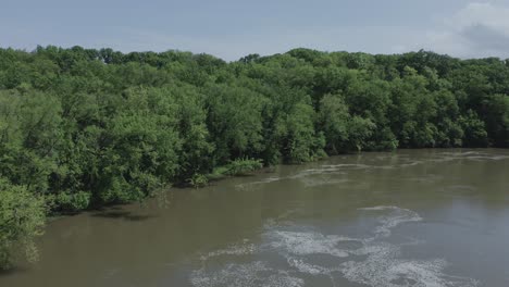 Drone-flies-along-a-river-in-the-Midwest-USA-in-the-summer