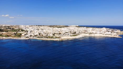 Drone-hyperlapse-video-from-Malta,-Marsaskala-area-from-Munxar-Path-at-winter,-flying-towards-Marsaskala