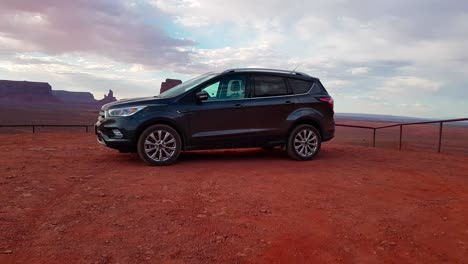 360-degree-gimbal-shot-of-2018-Ford-Escape-Titanium-at-sunset-in-Monument-Valley,-Arizona,-USA