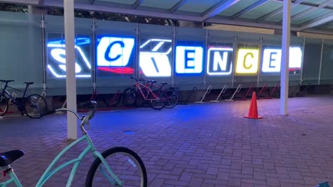 Rotating-letter-blocks-made-out-of-LED-lights-that-read-the-word-"SCIENCE"