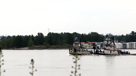 Gdansk,-Poland,-two-towboats-sailing-on-the-river-Motlawa