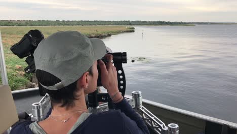 Photo-Safari-guest-photographs-Yellow-Billed-Stork-on-Chobe-R,-Africa