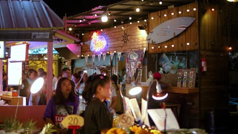 People-walking-in-night-market-street-in-Bangkok-slowmotion