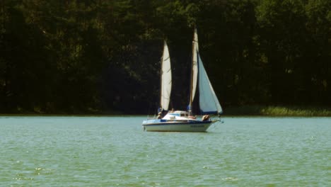 two-masted-Yacht-sailing-in-Wdzydze-Lake-in-Kaszubski-park-krajobrazowy-in-Pomeranian-Voivodeship