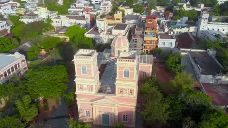 Top-Angle-Close-Up-Aerial-Orbital-shot-from-Left-To-Right-of-Our-Lady-Angeles-Church-on-an-early-morning-near-the-french-town,-Puducherry-shot-with-a-drone-in-4k