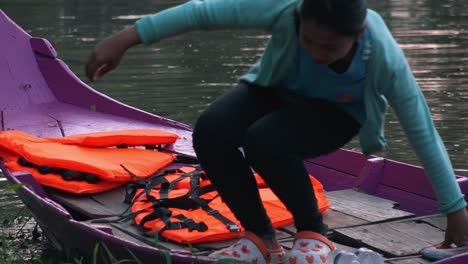 Close-Shot-of-a-Girl-on-a-Color-Boat