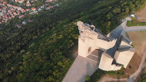 Aerial-drone-shot-of-the-Founders-of-the-Bulgarian-State-monument-overlooking-the-city-of-Shumen,-Bulgaria