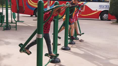 Slow-Motion-Shot-of-Some-Kids-on-The-Air-Walk-Exercise-Machines