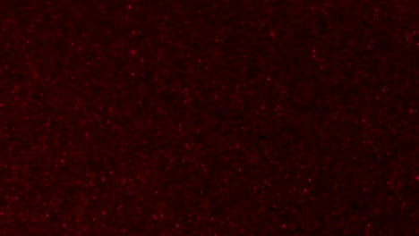 Fast-fizzy-blood-red-bubbles-on-a-deep-black-background