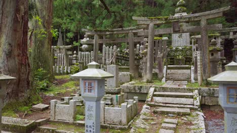 Old-historical-Cemetery-Oku-no-In-with-tombstones,-located-in-Koyasan---a-small-town-in-Japans-prefecture-Wakayama