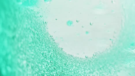 macro-shot-of-many-small-blue-bubbles-sparkling-in-water-with-a-bright-background