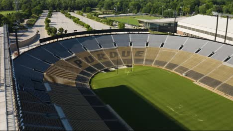 Aerial-Backwards-Reveal-of-Empty-Purdue-University-Football-Stadium