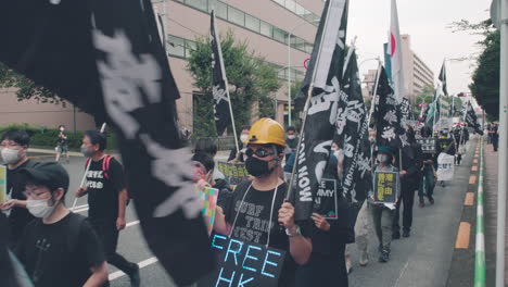Protesters-With-Free-Hong-Hong-Revolution-Now-Flag-Marched-In-Street-Of-Tokyo---Solidarity-For-Hong-Kong-Protests-In-Japan