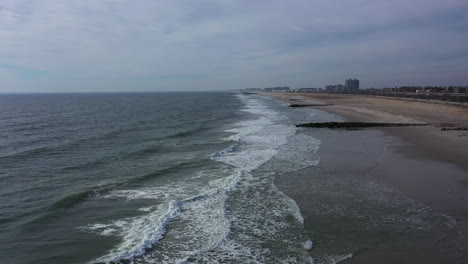 A-drone-view-of-an-empty-beach-on-a-cloudy-day