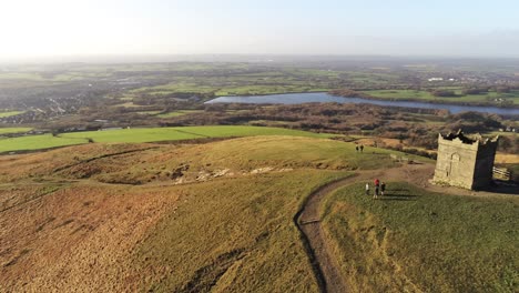 Historic-Rivington-tower-Lancashire-reservoir-autumn-countryside-aerial-pan-right-view