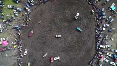 aerial-video-of-a-car-rally-while-rotating-and-pulling-up