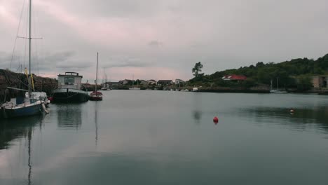 Flying-over-marina-with-moored-sailboats