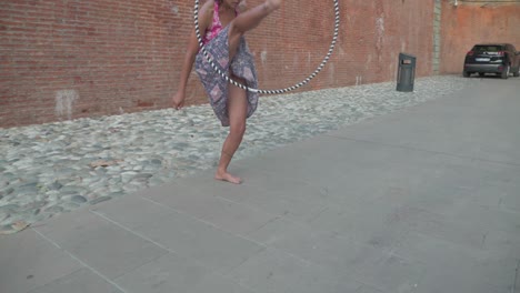 Slow-Motion-Close-up-and-Panning-of-Girl-Doing-Hula-Hoop