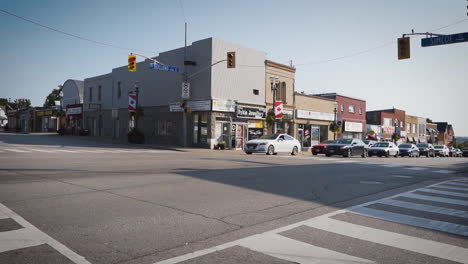 Cars-stopped-at-an-intersection-on-a-street-in-a-small-town