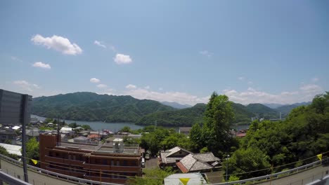 Bus-tour-with-a-go-pro-side-view-of-the-forest-and-town-passing-by