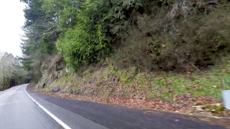 Driving-by-a-big-red-barn-near-the-road-in-Oregon