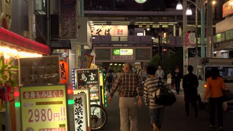 TOKYO,-JAPAN---:-JR-KOMAGOME-station,-East-exit,-4K,-people-passing-by-in-front-of-the-station-exit,-zoom-out,-Camera-fixed,-Angle-neutral-view