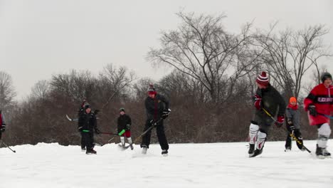 Slow-motion-of-a-teenager-skillfully-passing-opponents-playing-pond-hockey