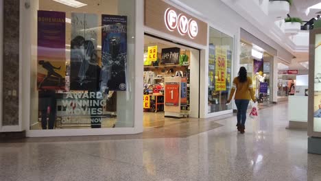 Woman-walking-and-shopping-in-mall-slow-motion