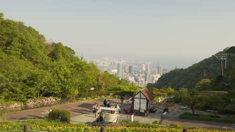 People-sitting-on-the-grass-at-Kobe's-Nunobiki-garden