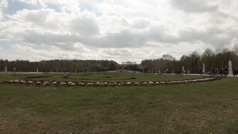 The-back-of-SchÃ¶nbrunn-Palace-garden,-Vienna,-on-a-partly-cloudy-afternoon