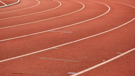 Athletics-running-track-bend.-TILT-SHOT