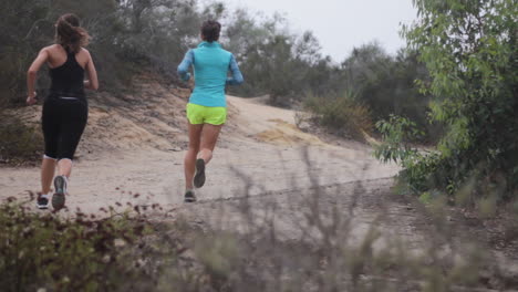 A-young-woman-turns-a-corner-and-runs-up-a-hill