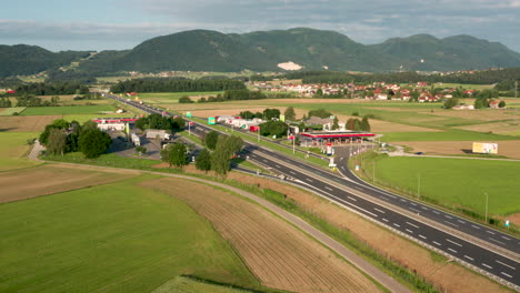 Aerial-view-of-truck-stop-on-highway-in-Slovenia,-Tepanje-rest-area-with-petrol-station