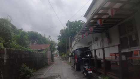 Point-of-View-Walking-Past-a-Small-Guesthouse-In-A-Skinny-Lane