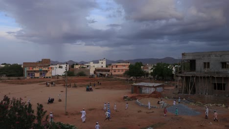 Time-laps-of-people-going-around-and-kids-playing-in-a-ground