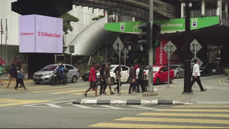 People-Crossing-Traffic-At-City-Centre-Downtown