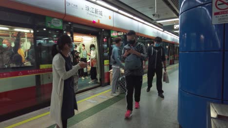People-walking-inside-metro-station-wearing-masks-during-COVID-19-pandemic