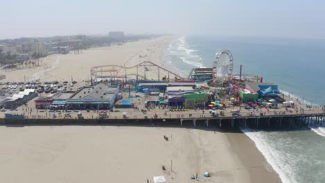 Aerial-fly-over-Santa-Monica-Pier-on-a-sunny-Summer-morning