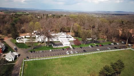 Majestic-huge-white-mansion-in-aerial-view-in-Whitehouse-Station-town