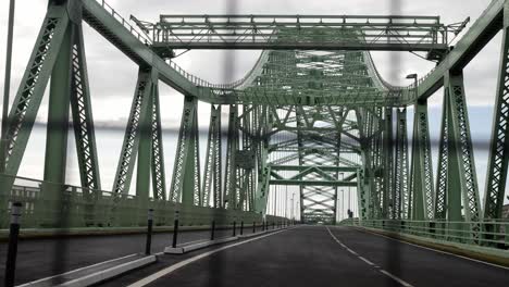 Closed-empty-unused-Runcorn-Silver-Jubilee-bridge-crossing-close-dolly-left-through-security-fence