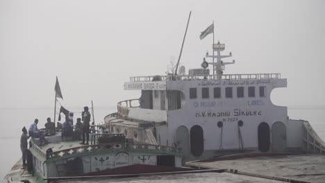 Bangladeshi-flag-sand-trawler-is-underway-in-the-river-and-people-are-resting