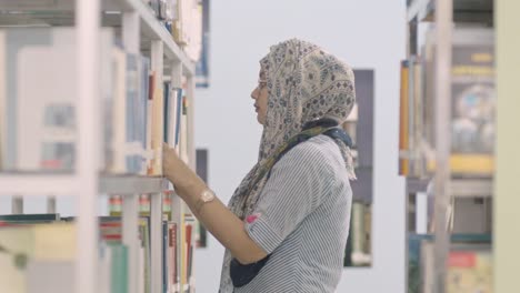 Student-selecting-books-from-the-university-library