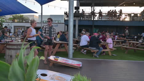 People-Eating-And-Playing-Game-At-Mike-Hess-Brewing-Brewpub-In-Imperial-Beach,-California-At-Daytime