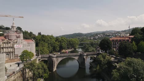 Revealing-the-Sao-Goncalo-monastery-and-the-bridge-over-the-Tamega-river-in-Amarante,-Portugal