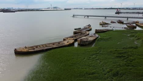 Drone-footage-of-old-abandoned-World-War-Two-concrete-barges-in-the-Thames-river,-that-were-an-integral-part-to-get-troops-and-equipment-on-to-the-beaches-during-the-of-the-D-Day-Normandy-landings