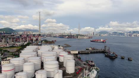 Hong-Kong-commercial-Port,-aerial-approach-passing-above-Oil-and-Chemical-storage-depot