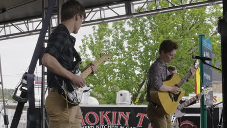 Band-plays-concert-at-Dogwood-Festival,-Siloam-Springs,-AR,-wide-shot