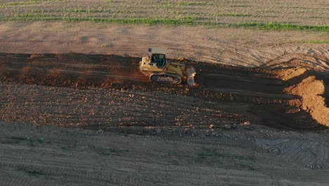 CAT-bulldozer-pushes-earth-into-pile