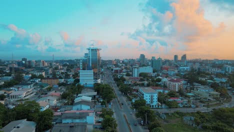 Cityscape-of-residential-buildings,-Helipad,-and-major-roads-during-sunrise